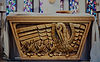 A wooden altar with a white cloth over it